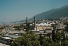city buildings under the blue sky