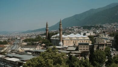 city buildings under the blue sky