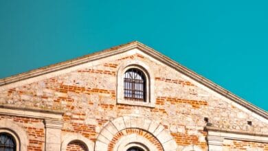a church with a clock on the side of it